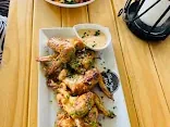 Grilled prawns platter served on a wooden table