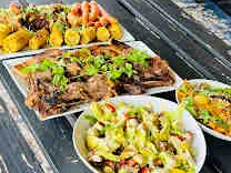 A generous spread of grilled meats and salads at Eraa Village