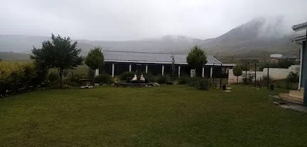 Eraa Village venue nestled against the misty Eastern Cape mountains